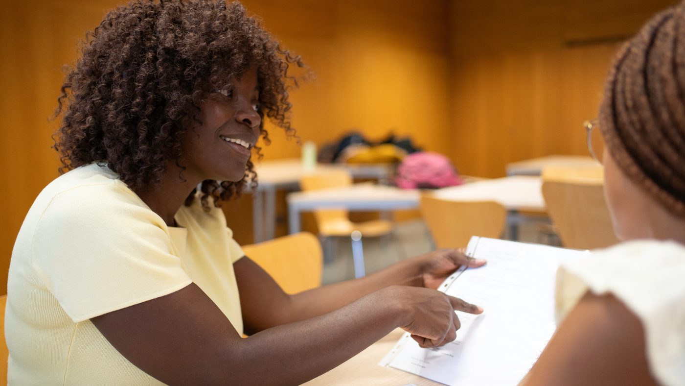 Two participants reviewing financial materials together